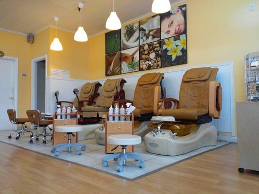 Full-body massage pedicure chairs.