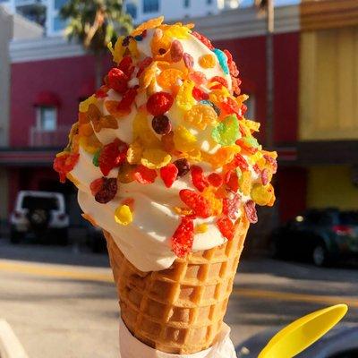 Vanilla soft serve, fruity pebble topping, waffle cone