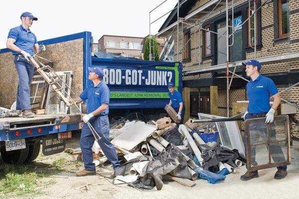 1-800-GOT-JUNK? Truck Team Members clearing construction debris