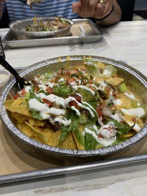 Build your own nachos - barbacoa, lettuce, tomato, pico, sour cream, queso, guac