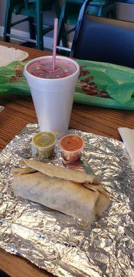 This is a self served agua de Jamaica, small steak burrito w/everything, hot'n mild salsa.