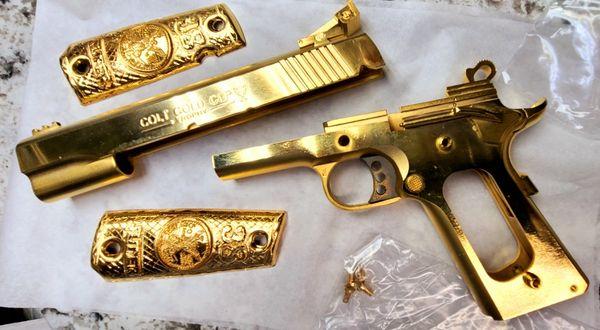 Firearm after 18k Micron Gold Plating.