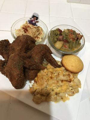 Fried chicken, macaroni and cheese, potato salad, string beans, and cornbread muffin