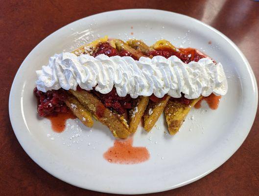 French toast with strawberry and whipped cream. Had thick bacon as well (not pictured)