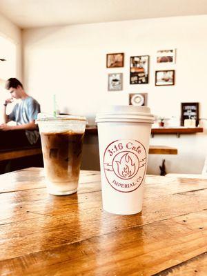 Iced Caramel Macchiato and Hot Cinnamon Roll Latte. Inside cool coffee shop.