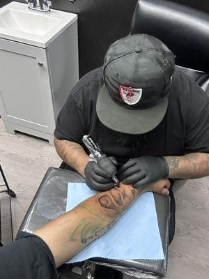 Aaron getting down on a new tattoo