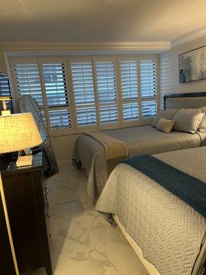 The plantation shutters totally changed our 2 bedrooms.