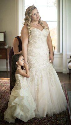 Flower girl and bride in matching champagne dresses