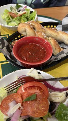 Bread sticks with marinara, Italian salad which we split.