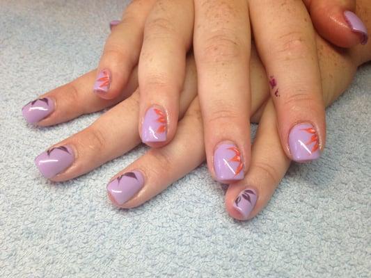 Acrylic nails with gel polish and spring flowers.