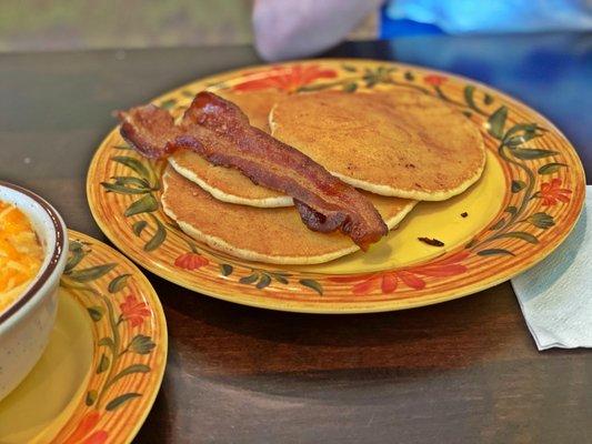 Kids pancakes with bacon. Came with two pieces but he ate one before I could snag a picture. Lol