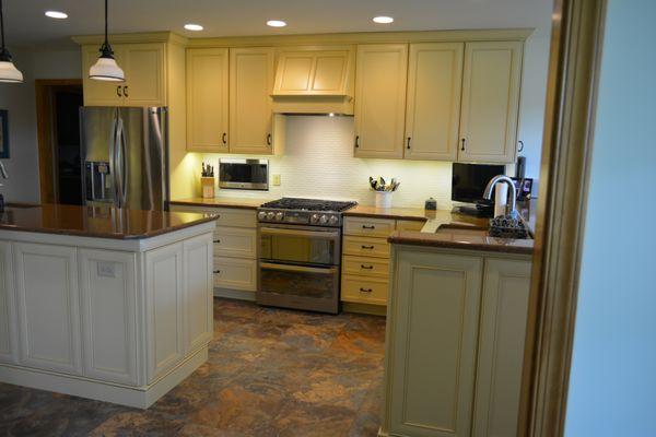 Sunny Yellow cabinets give this kitchen the beauty of spring year round