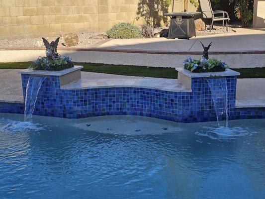 We envisioned this, and it was a challenge for Henry's team due to the odd shape of the pool edge. They knocked it out of the park!