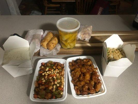 The feast - kung po shrimp, sesame chicken, veggie lo mein, egg rolls, wonton soup