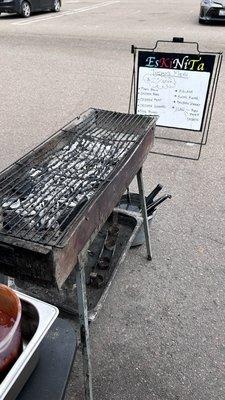 Outside: charcoal grill out front