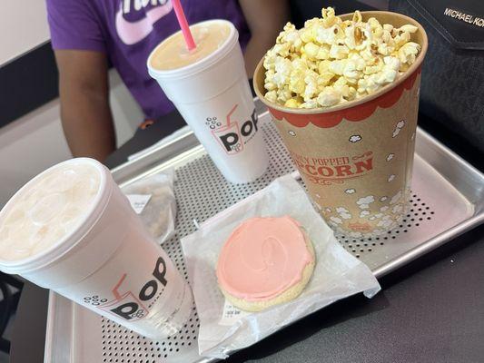 Popcorn, frosted cookie, Reese's cookie, small oasis drink & small Mountain Dew with mango purée.