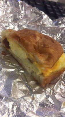 I got a croissant bacon, egg and cheese sandwich made with love