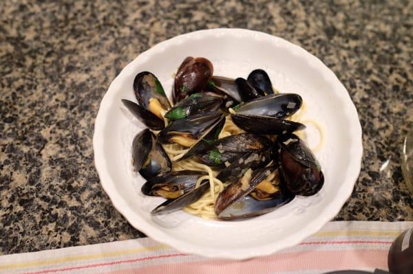 Mussels cooked in shallots and white wine on homemade spaghetti