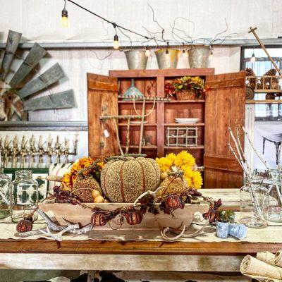 Vintage home decor atop a farm house table.