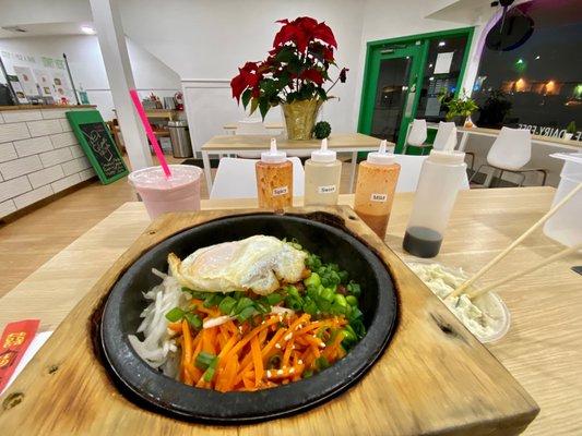 Bibimbap with fried egg, bulgogi and honey chicken.