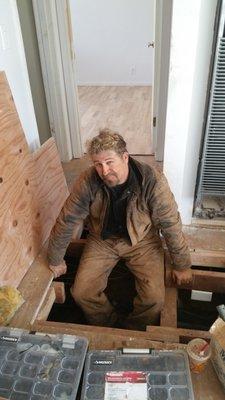 Jeff inspecting a repipe that we did under a home. Tough day at the office.