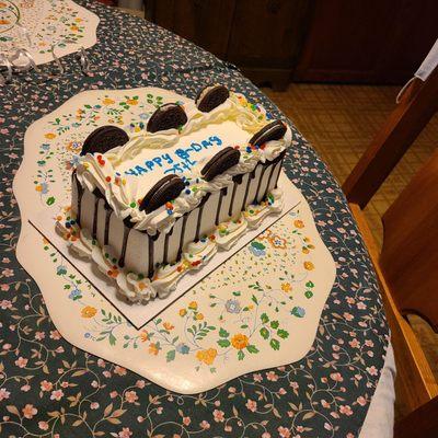 Yummy chocolate cake with chocolate chip ice cream and whip cream frosting and oreo cookie halves