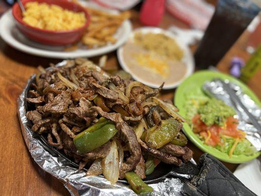 Steak fajitas with beans and rice