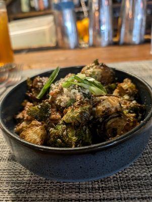 CRISPY PECAN BRUSSELS SPROUTS candied pecans, sweet serrano sauce, shaved green onion, sprinkled parmesan