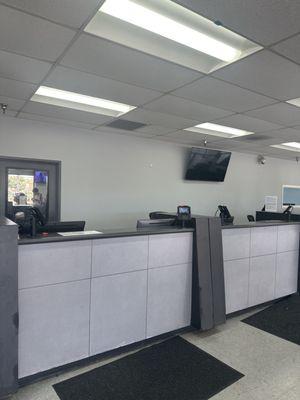 Empty counters without associates and long line of people waiting