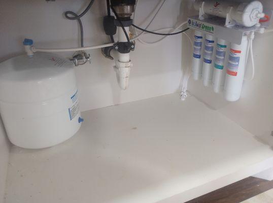 Reverse Osmosis under kitchen sink.