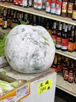 This tiny woman hauled out this Winter Melon, weighed more than her!