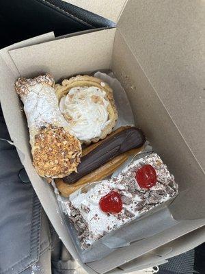 I chose a cassata cake slice, cannoli, eclair, and coconut cream pie