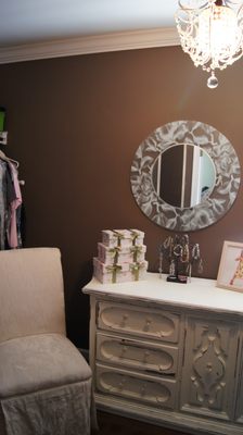 Master closet renovation. Reclaimed dresser, chalk painted and distressed, new knobs. Hanging chandelier.