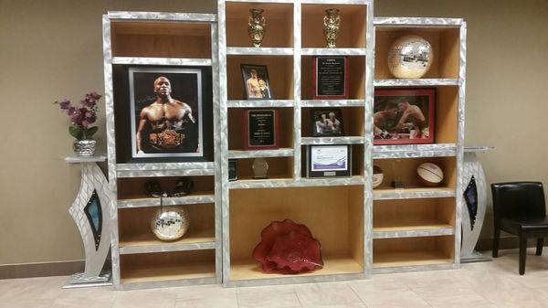 Boxing photos, community awards, basketballs and,my favorite anomaly, 2 full sized Disco balls.