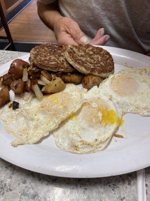 Scott special, three eggs, toast, home, fries, and sausage patties