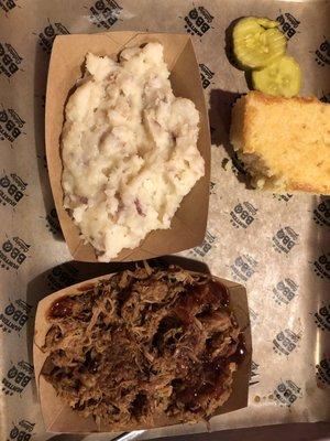 Pulled pork, garlic mashed potatoes, and sweet corn bread.