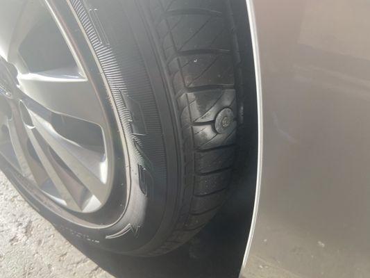 Tire with nail.