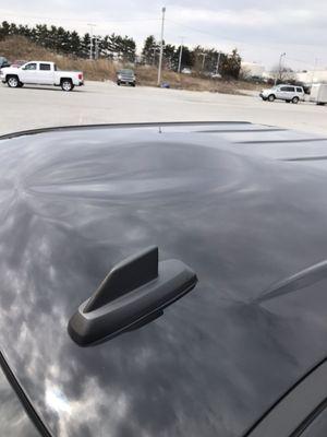 Larger dent on roof of Chevy Silverado. Before