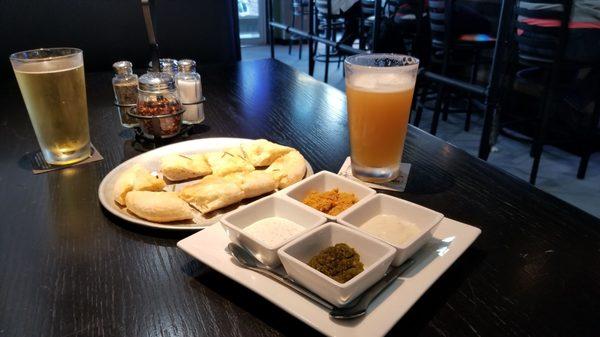 Bread with 4 killer dipping sauces made in house.