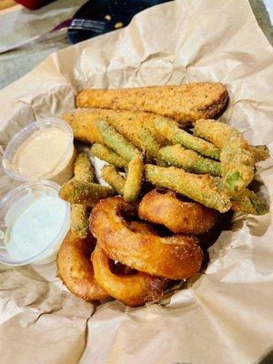 Appetizer trio with onion rings, fried green beans, and fried pickles. Served with ranch and cayenne ranch. Soooo good!!