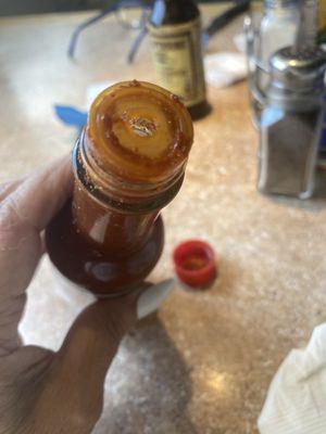 Dirty sauce bottle