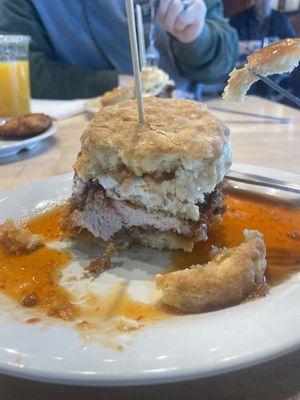 Fried chicken with a fried goat cheese medallion on homemade pepper jelly.