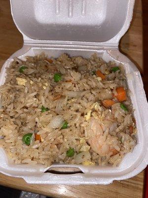 "Fried" rice with tail-on shrimp which was tasteless and crunchy