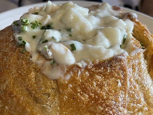 Bread bowl of cold clam chowder soup