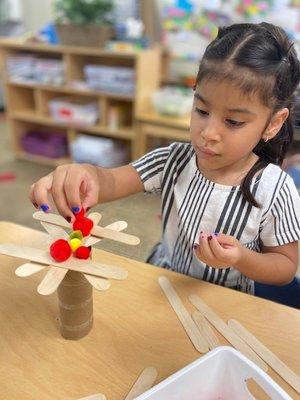 Emilia creates an apple tree using her STEAM skills.  Will it hold one more apple?