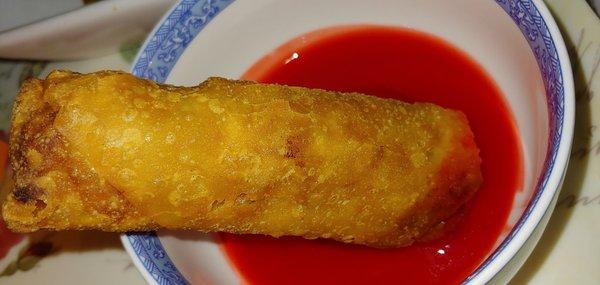 Delicious, crispy eggroll with sweet and sour sauce.