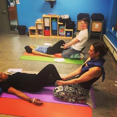 Co-founder, Cassie Fireman, teaching thai body work at her free thai massage workshop at Harlem Dream Center