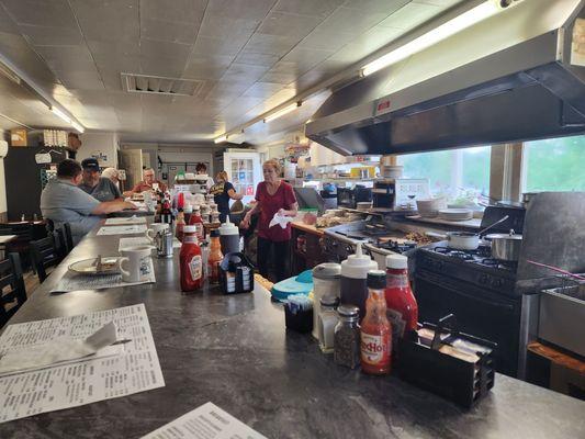 Interior seating and short order cooks line