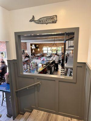 Peek-a-boo hole into the bar and dining area