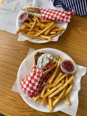 Chicken shawarma wrap. And gyro pita sandwich with fries.